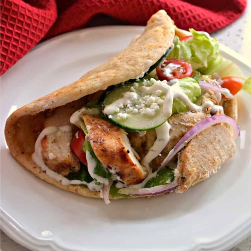 chicken shawarma with cheese on pita bread