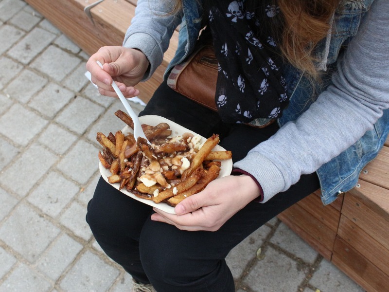 enjoying poutine outside