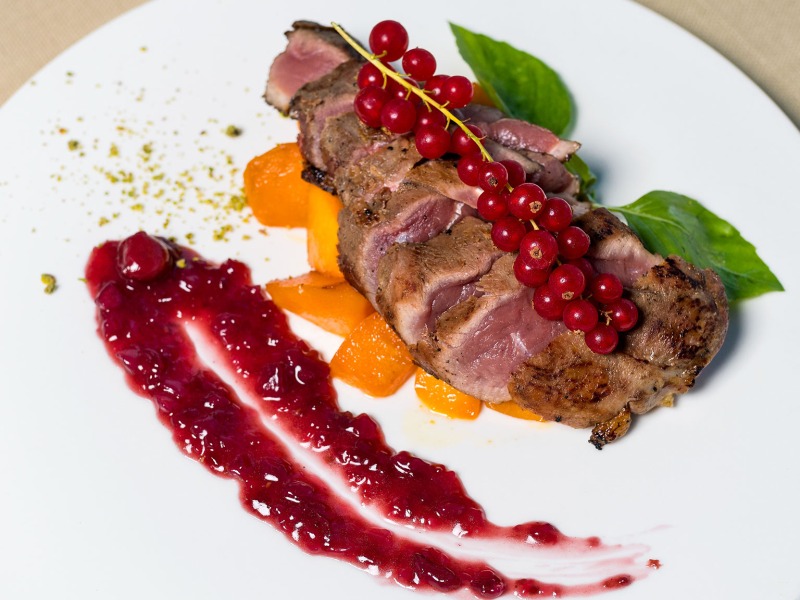 rare beef tenderloins on a fine dining dish