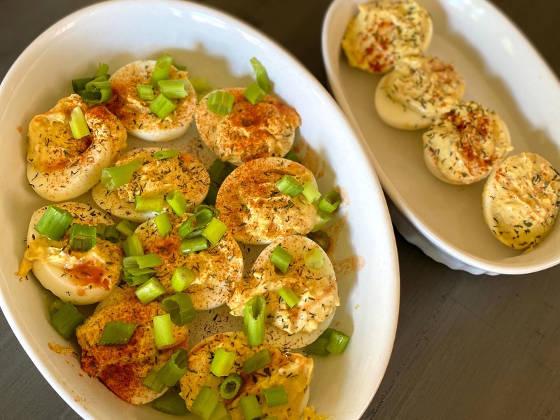 deviled egg with green onion on plates