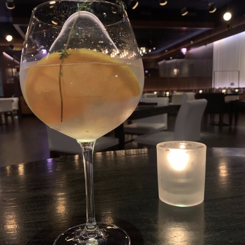 rpm steakhouse gin cocktail with candle