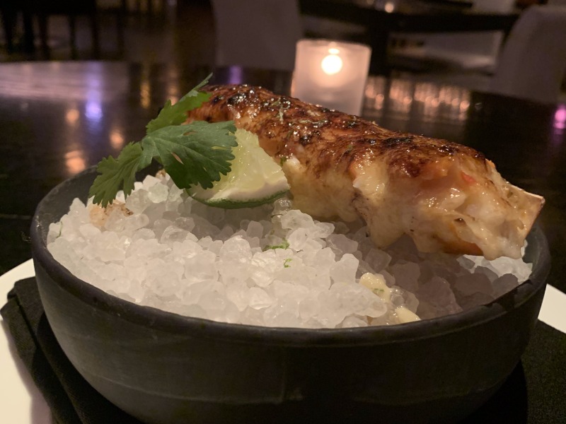 rpm steakhouse lobster tail in dry ice with lemon wedge