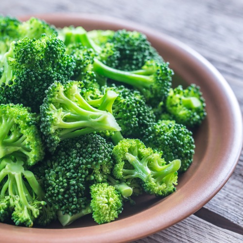 Broccoli on a brown plate