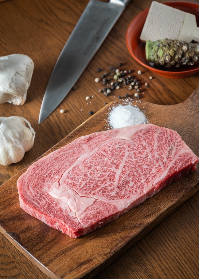 Steak from a Wagyu cow featuring garlic and peppercorn