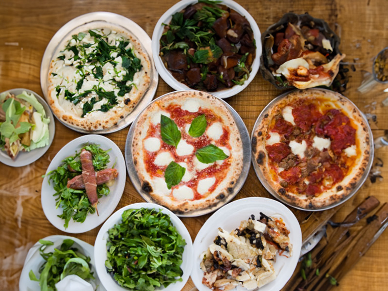 Freedom Brothers Pizzeria display of food items featured on the Plainfield, IL menu