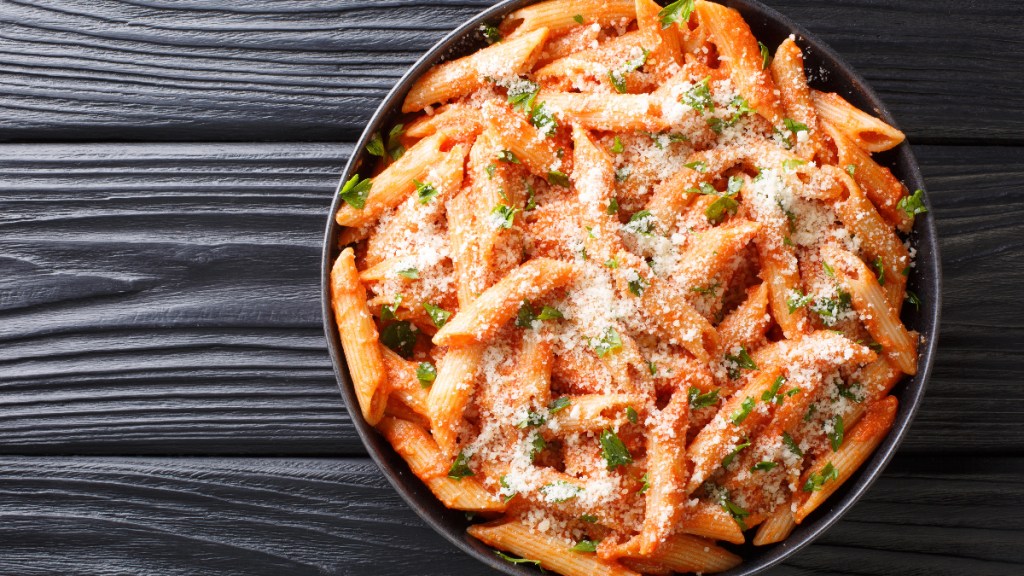 gluten free penne pasta on a black table