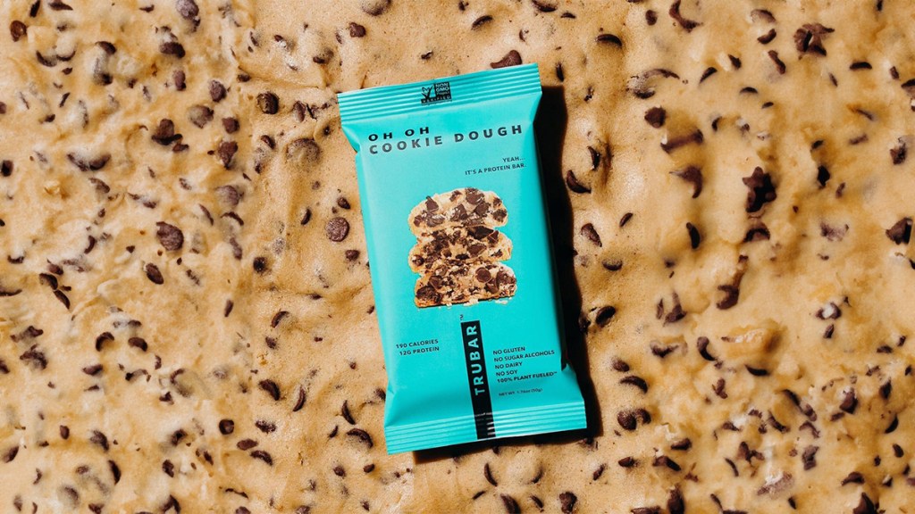 oh oh cookie dough trubar bars with a chocolate chip background
