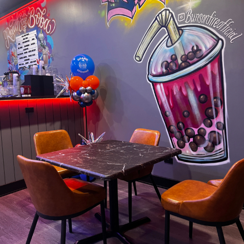 Buns On Fire leather seating featuring spray paint art