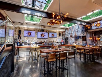 Benchmark Chicago restaurant interior with TVs