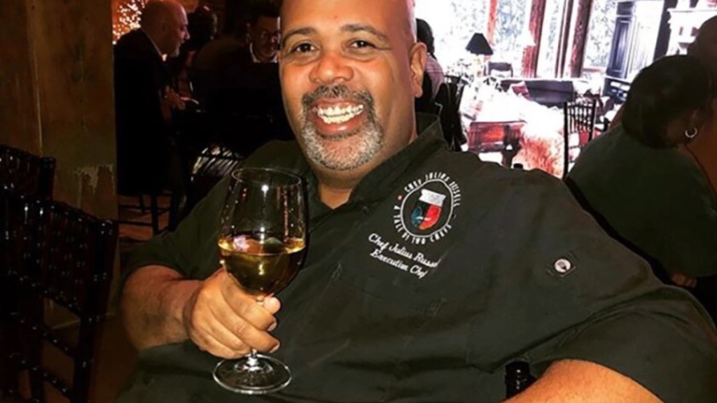 Julius Russell Chicago executive chef with  wine glass